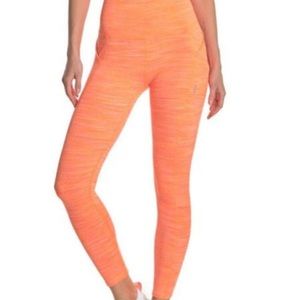 Brand New with tags Free People Orange leggings.